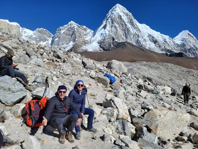 HimalayanHero Adventures trekkers posing by the Everest Base Camp sign