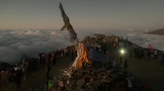 Trekking above clouds on Mardi Himal with Machhapuchhre peak in view