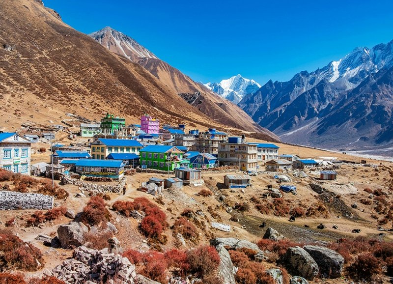 "Local teahouse in Langtang Valley featuring cozy twin-share rooms and rustic traditional decor."