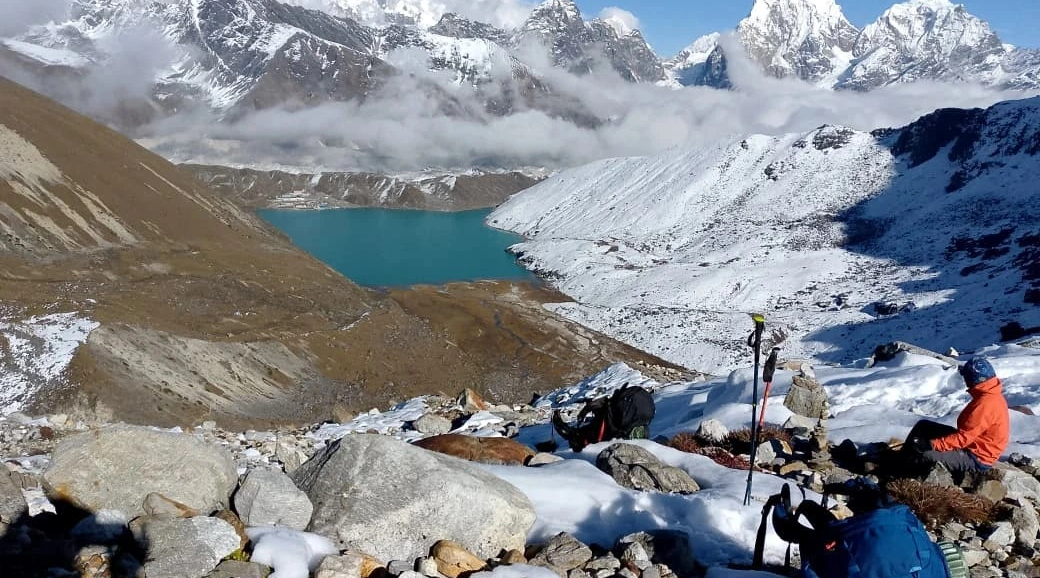 trekkers enjoying birendra lake in manaslu circuit trekking