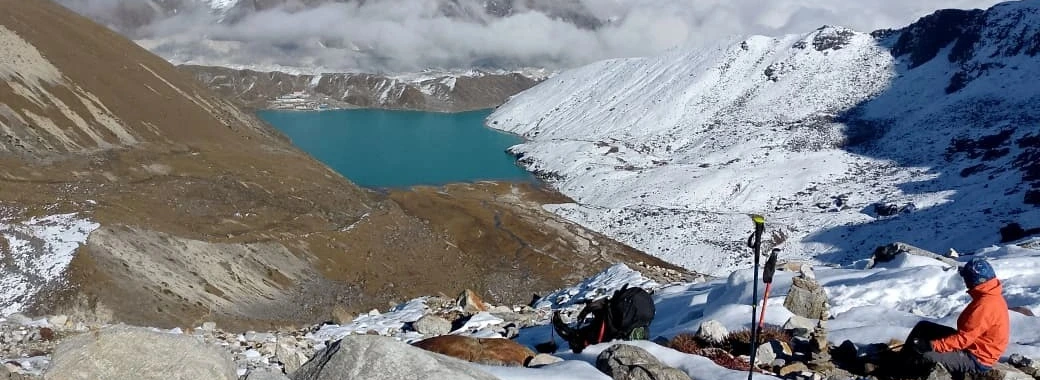 trekkers enjoying birendra lake in manaslu circuit trekking