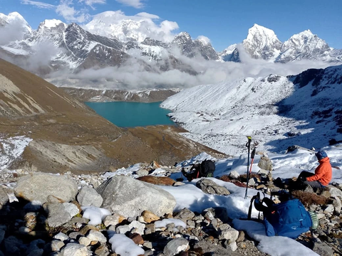 trekkers enjoying birendra lake in manaslu circuit trekking