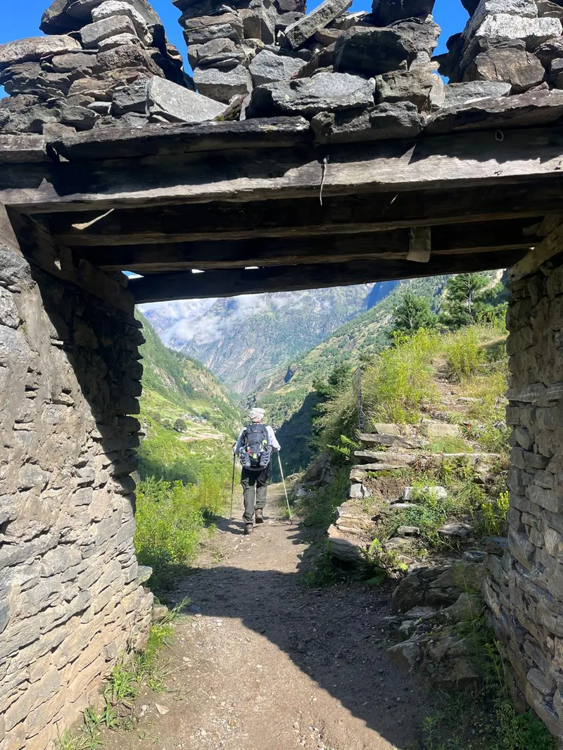 Traditional stone entrance gate along the Short Manaslu Circuit Trek trail, highlighting local culture and Himalayan architecture.
