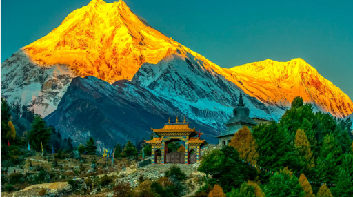 Panoramic view of snow-covered peaks from near Larkya La Pass on the Manaslu Circuit trek.