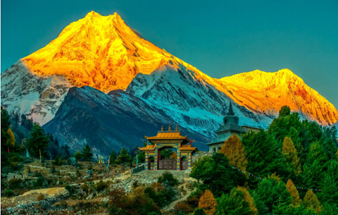 Panoramic view of snow-covered peaks from near Larkya La Pass on the Manaslu Circuit trek.
