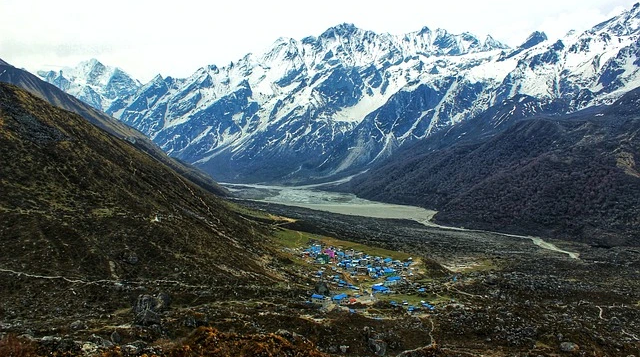 Panoramic view of Langtang Valley village surrounded by high Himalayan mountains along the Langtang Gosaikunda trek route