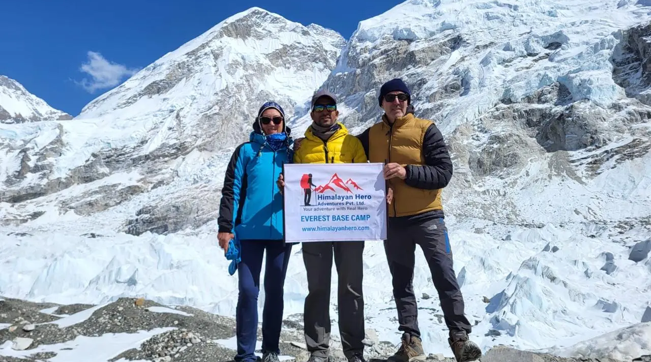 group of trekkers from himalayanhero adventures taking success photo on everest base camp