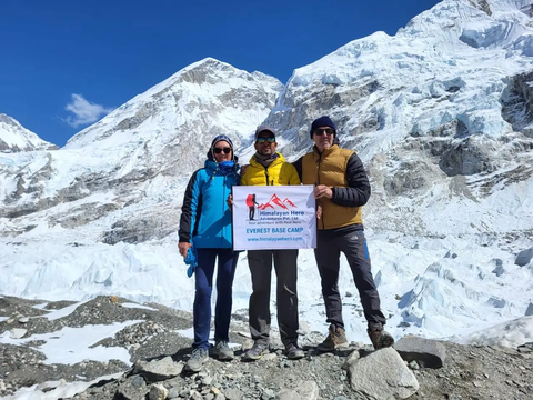 group of trekkers from himalayanhero adventures taking success photo on everest base camp