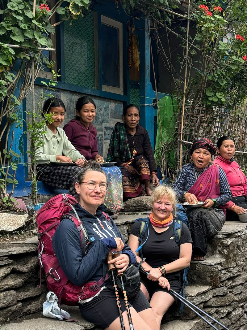 group-of-trekkers-taking-picture-with-locals-in-manaslu-region
