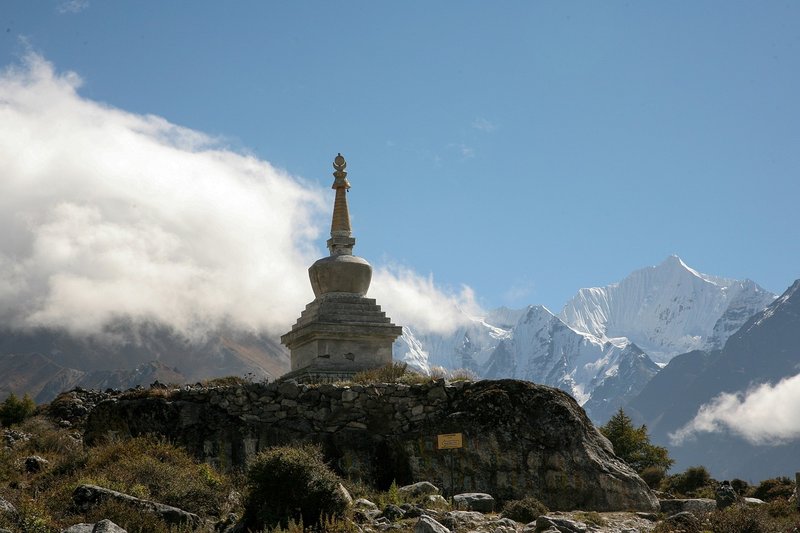 "Rocky-mountain-path-and-gumpa-along-the-rugged-Langtang-Valley-trekking-trail-in-Nepal."