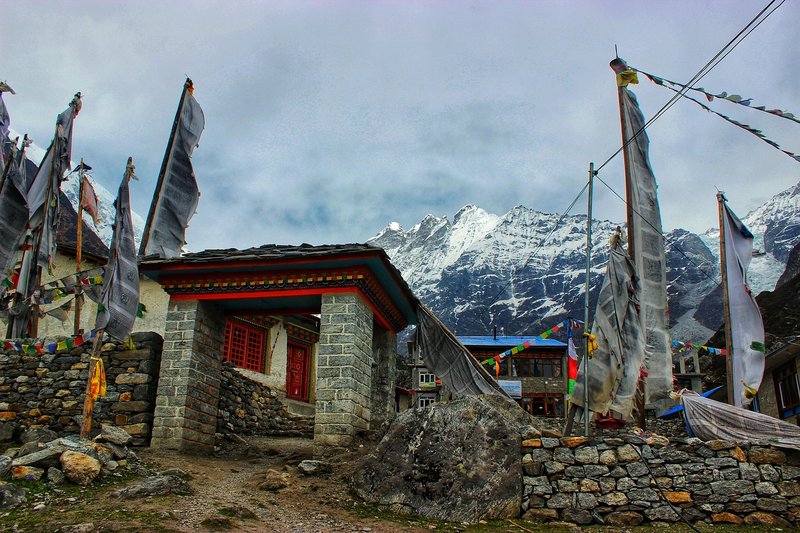 "Kyanjin Gompa monastery with dramatic mountain scenery in Langtang"