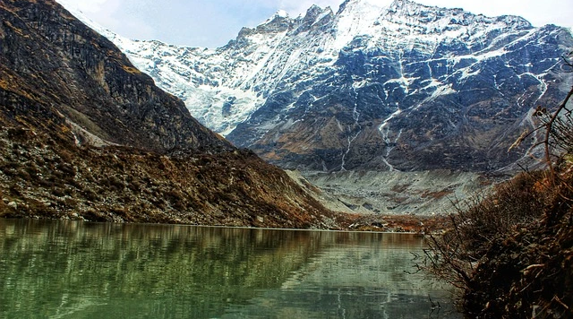 Sacred Gosaikunda Lake with snow-capped peaks in the Langtang Helambu trekking region