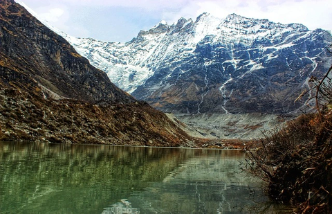 Sacred Gosaikunda Lake with snow-capped peaks in the Langtang Helambu trekking region