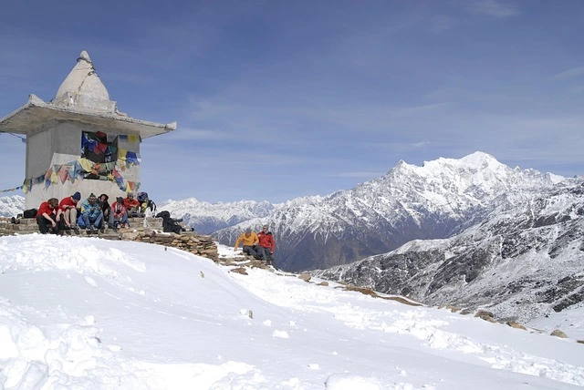 Fresh snowfall covering the Langtang Valley trail with Himalayan mountains during winter trekking season