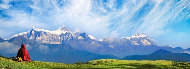 a monk enjoying the view of annapurna sanctuary