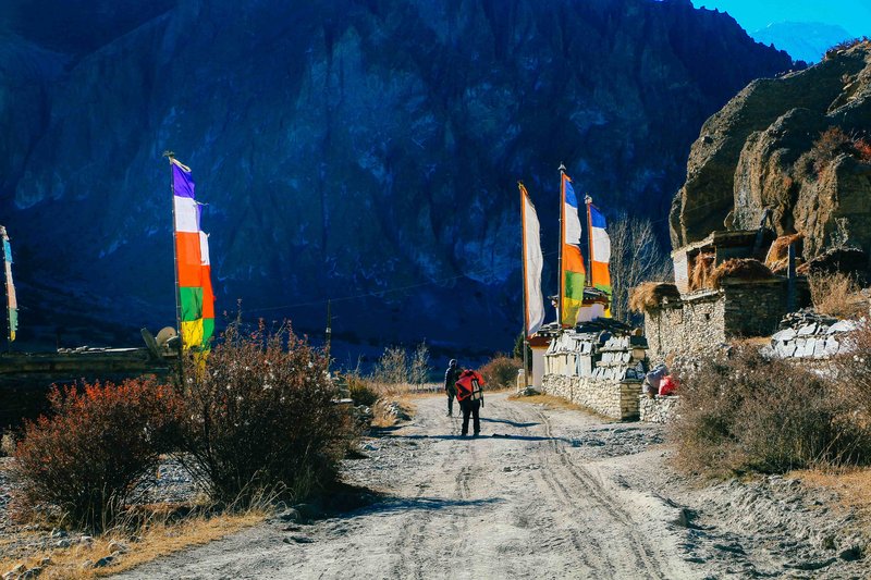 Colorful Tibetan prayer flags waving on the North Annapurna Base Camp trek