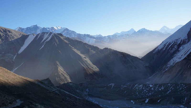 Golden sunset over Annapurna mountain range viewed from Annapurna Circuit trekking trail Nepal