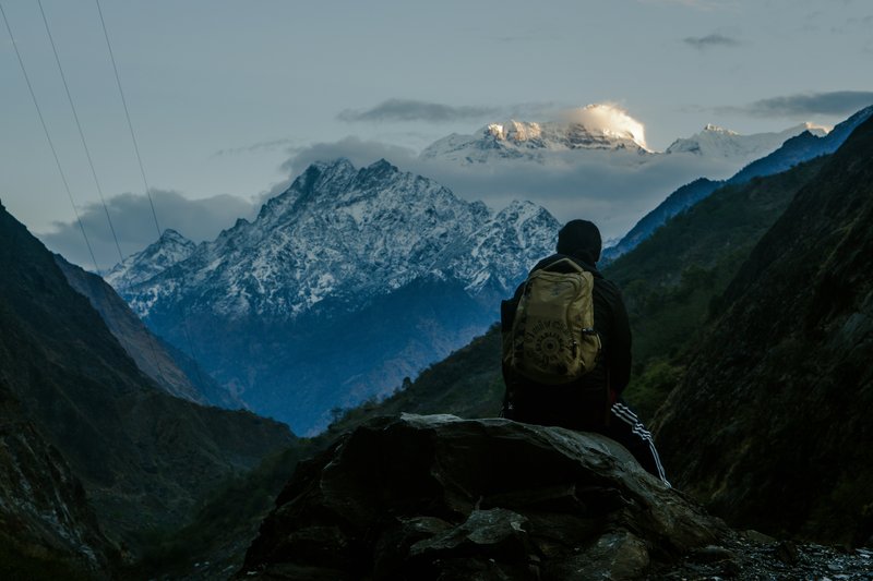 Trekkers navigating a narrow path with steep drop-offs.