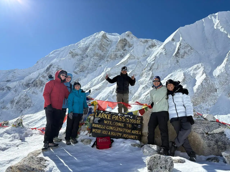 Trekkers from HimalayanHero crossing Larkya La Pass during the Manaslu Tsum Valley Trek.