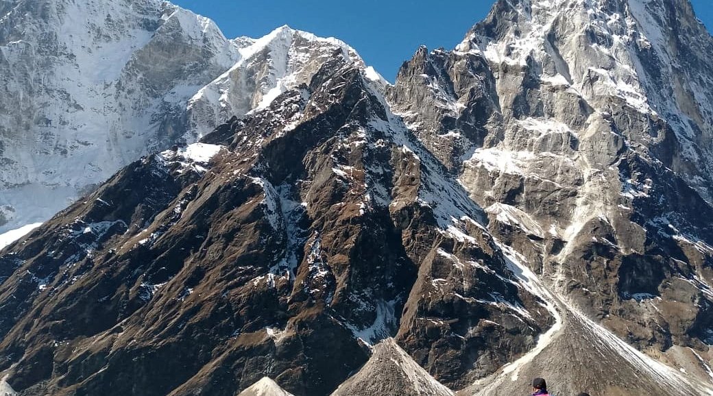 trekkers enjoying the view of beautiful mountains in nepal trekking