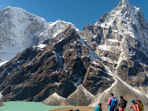 trekkers enjoying the view of beautiful mountains in nepal trekking