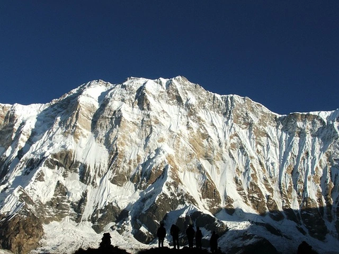 trekkers enjoying view of annapurna range from close